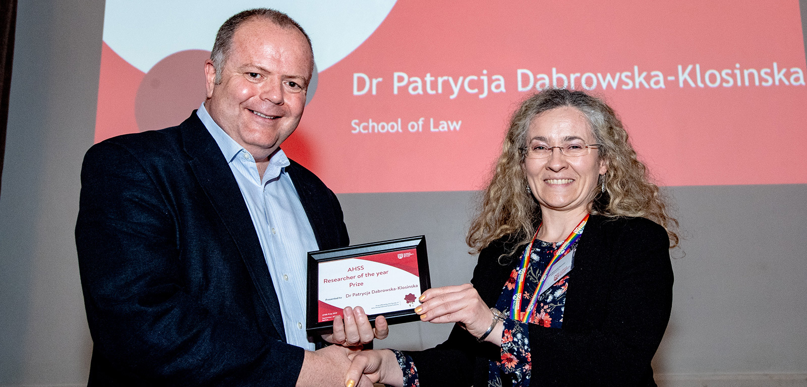 Dr Patrycja Dąbrowska-Kłosińska receiving award from Professor Paul Connolly